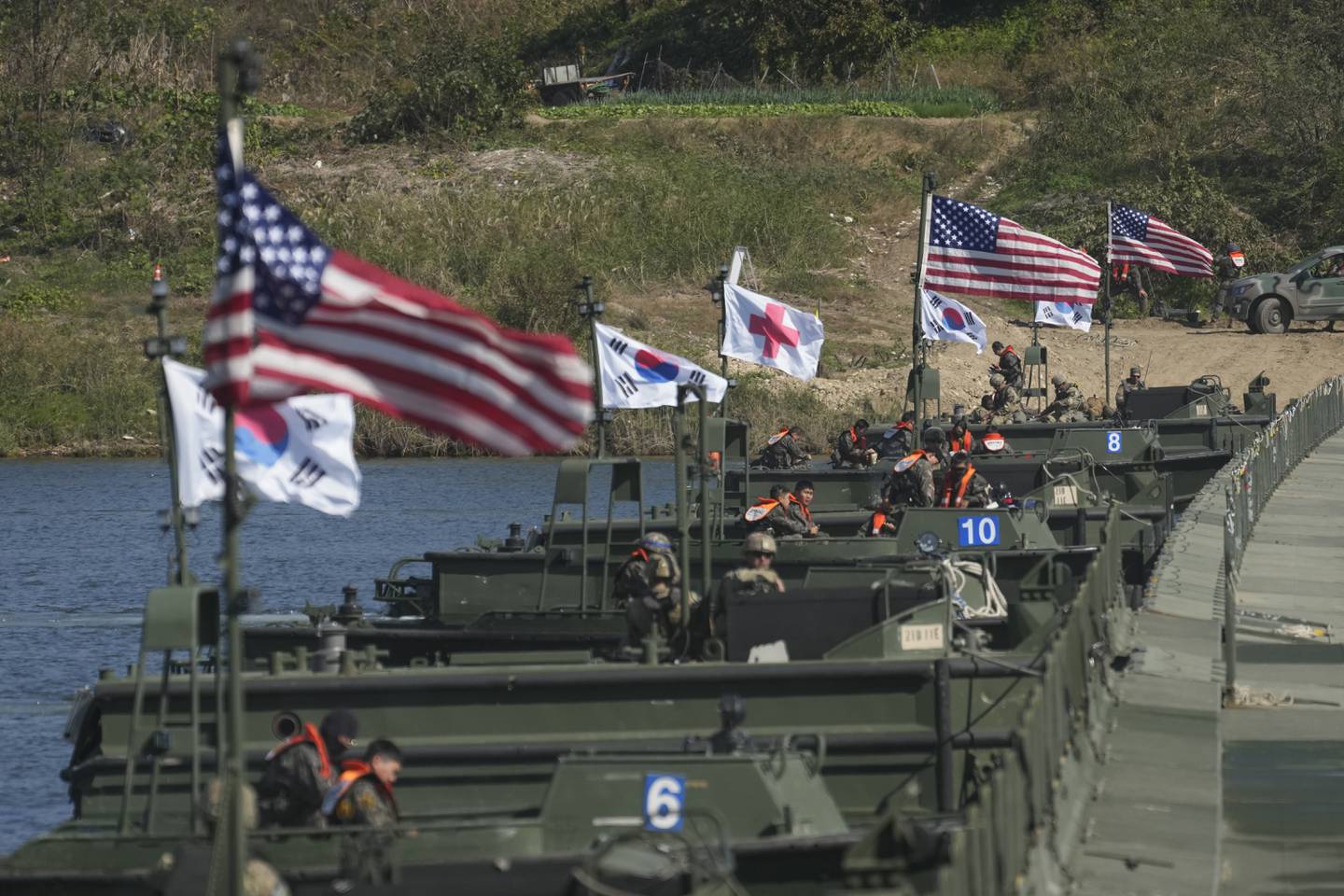 Flags of South Korea and the United States flutter before a joint river-crossing drill between South Korea and the United States in Yeoju, South Korea on Oct. 19, 2022.