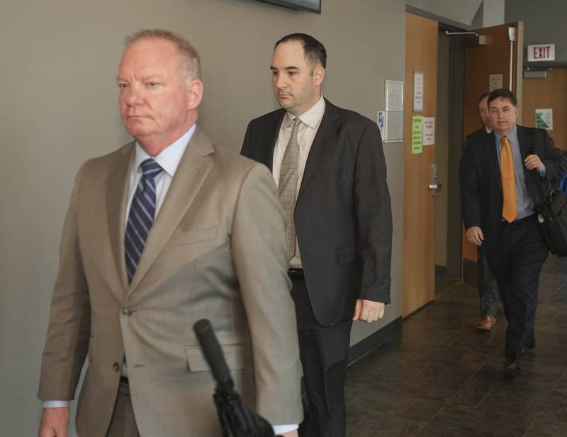 Army Sgt. Daniel Perry, center, and  his attorney Doug O'Connell, left, walk out of the courtroom during jury deliberations in his murder trial, Friday, April 7, 2023, at the Blackwell-Thurman Criminal Justice Center in Austin, Texas.