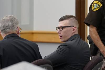 Volodymyr Zhukovskyy speaks with defense attorney Steve Mirkin at Coos County Superior Court, in Lancaster, N.H., Monday, July 25, 2022.