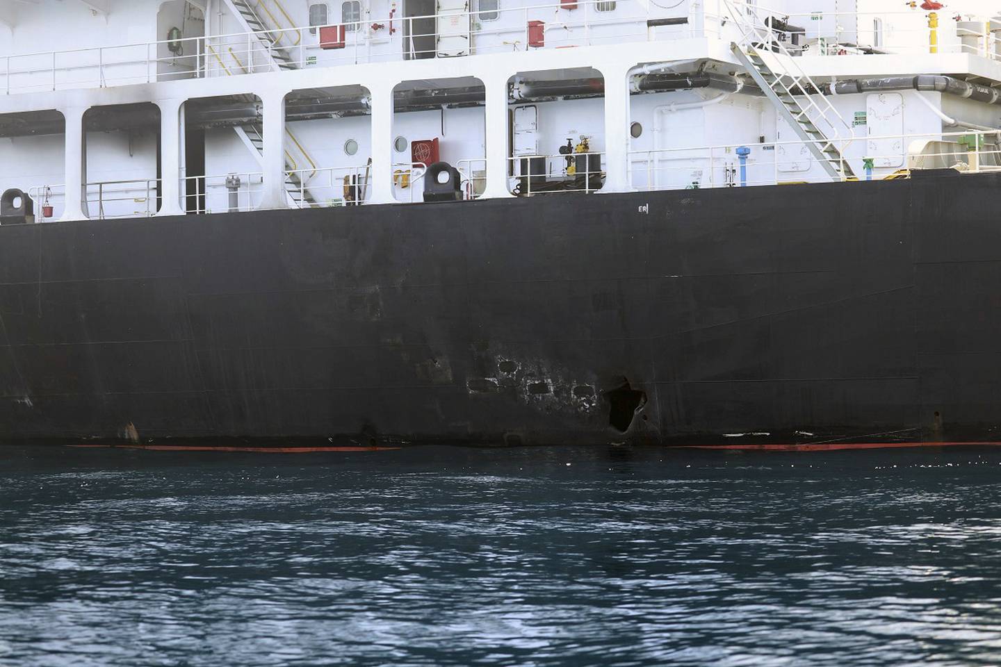 This image released by the U.S. Department of Defense on Monday, June 17, 2019, is a view of hull penetration/blast damage on the starboard side of the motor vessel M/T Kokuka Courageous, which the Navy says was sustained from a limpet mine attack while operating in the Gulf of Oman, on June 13th. (U.S. Department of Defense via AP)