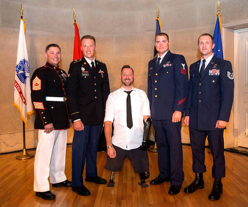 2019 Service Members of the Year, from left: Master Sgt. Jarad Stout, Spc. Shayn Lindquist, Army veteran Adam Keys, Boatswain’s Mate 1st Class Nathan Reynolds and Tech. Sgt. Cody Smith.