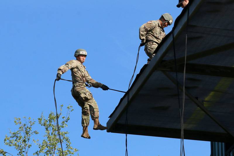 A soldier attending Air Assault School jumps from a 58-foot tower for the first time as he rappels down a rope at Joint Base Elmendorf-Richardson, July 16, 2018.