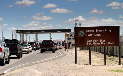 Cars wait to enter Fort Bliss, Texas, Sept. 9, 2014.