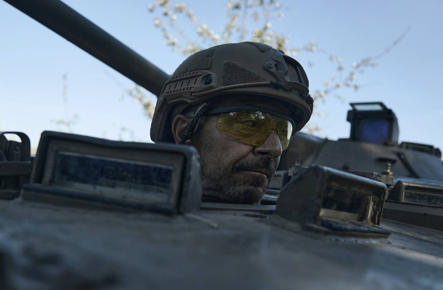 A Ukrainian soldier looks out an APC at the front line near Bakhmut, one of the longest battles with Russian troops, Donetsk region, Ukraine, Monday, Aug. 14, 2023.