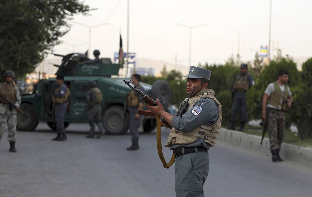 Afghan security personnel secure the site of an attack in Kabul, Afghanistan, on July 28, 2019.