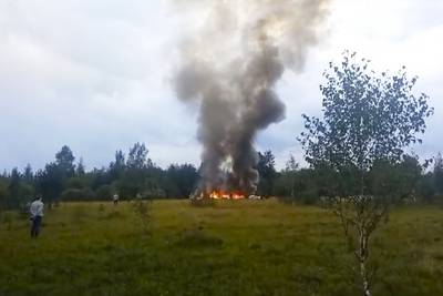 In this image taken from video, smoke rises from the crash of a private jet near the village of Kuzhenkino in the Tver region of Russia, on Wednesday, Aug. 23, 2023.