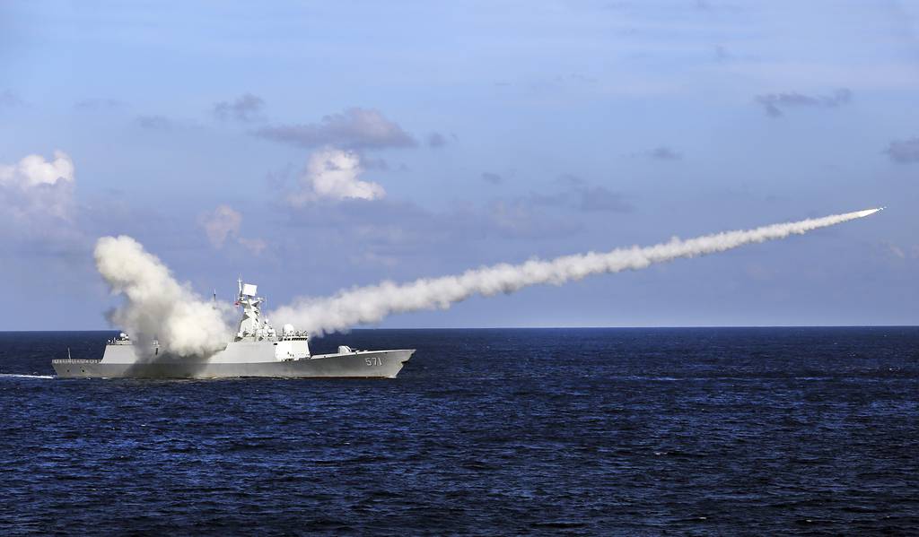 In this July 8, 2016, file photo released by Xinhua News Agency, Chinese missile frigate Yuncheng launches an anti-ship missile during a military exercise in the waters near south China's Hainan Island and Paracel Islands.