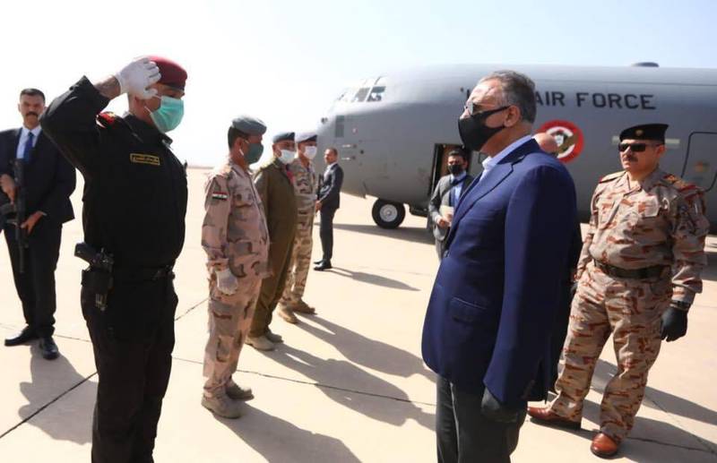 Iraqi Prime Minister Mustafa al-Kahdimi, right, arrives to Mosul, Iraq, Wednesday, June 10, 2020.