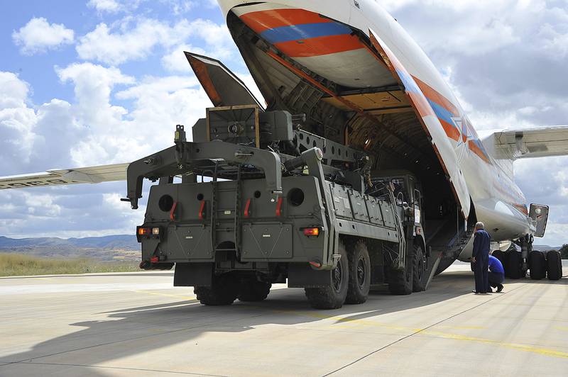 Military vehicles and equipment, parts of the S-400 air defense systems, are unloaded from a Russian transport aircraft, at Murted military airport in Ankara, Turkey, Friday, July 12, 2019.