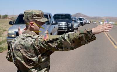 Arizona National Guard service members direct visitor check-in at a temporary COVID-19 testing site on the Navajo Nation May 19, 2020, in Tonalea, Ariz.