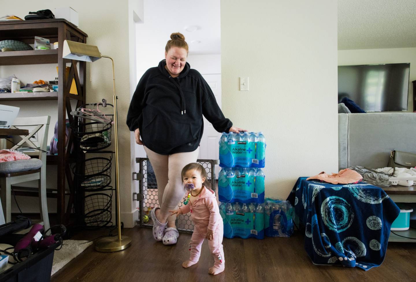 Heather Nguyen plays with her daughter, Chloe, in their home on Joint Base Lewis-McChord.