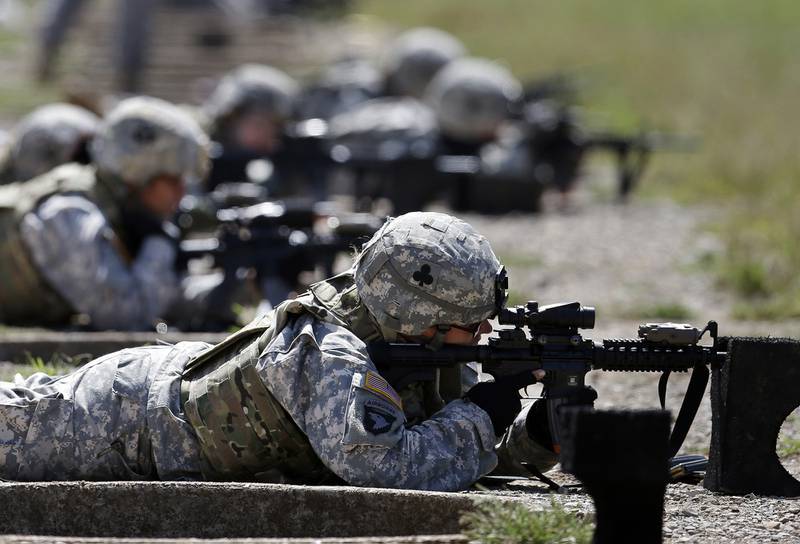 In this Sept. 18, 2012, file photo, female soldiers from 1st Brigade Combat Team, 101st Airborne Division train on a firing range while testing new body armor in Fort Campbell, Ky.