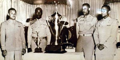 U.S. Air Force Capt. Alva Temple, 1st Lt. James Harvey, 1st Lt. Harry Stewart and 1st Lt. Halbert Alexander pose with their 1949 Weapons Meet trophy in May 1949 at the Flamingo Hotel in Las Vegas, Nev. (U.S. Air Force photo)