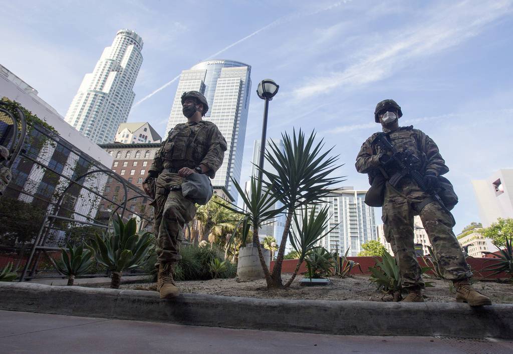 In this May 31, 2020, file photo members of the California National Guard patrol in Los Angeles.