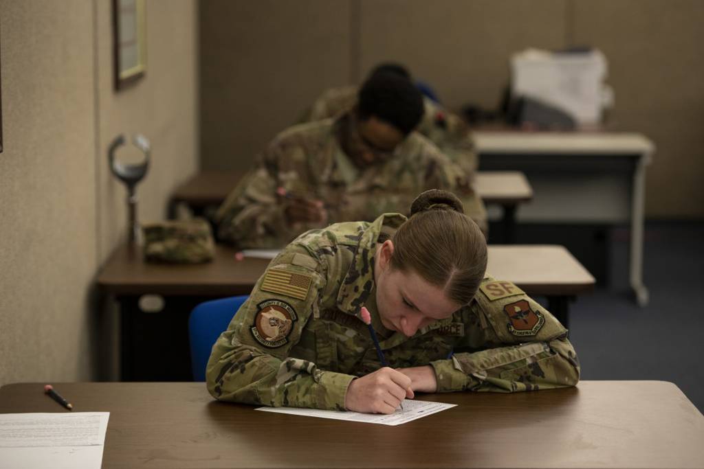 Senior Airman Jewel Favreau, assigned to the 97th Security Forces Squadron, fills out a promotion testing form, May 20, 2020 at Altus Air Force Base, Oklahoma. (Tech. Sgt. Kenneth Norman/Air Force)