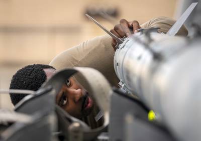 Staff Sgt. Donoven Wright, 43rd Fighter Generation Squadron, checks AIM-120 fins during the unit’s weapons load competition Feb. 11 at Eglin Air Force Base, Fla. (Samuel King Jr./Air Force)