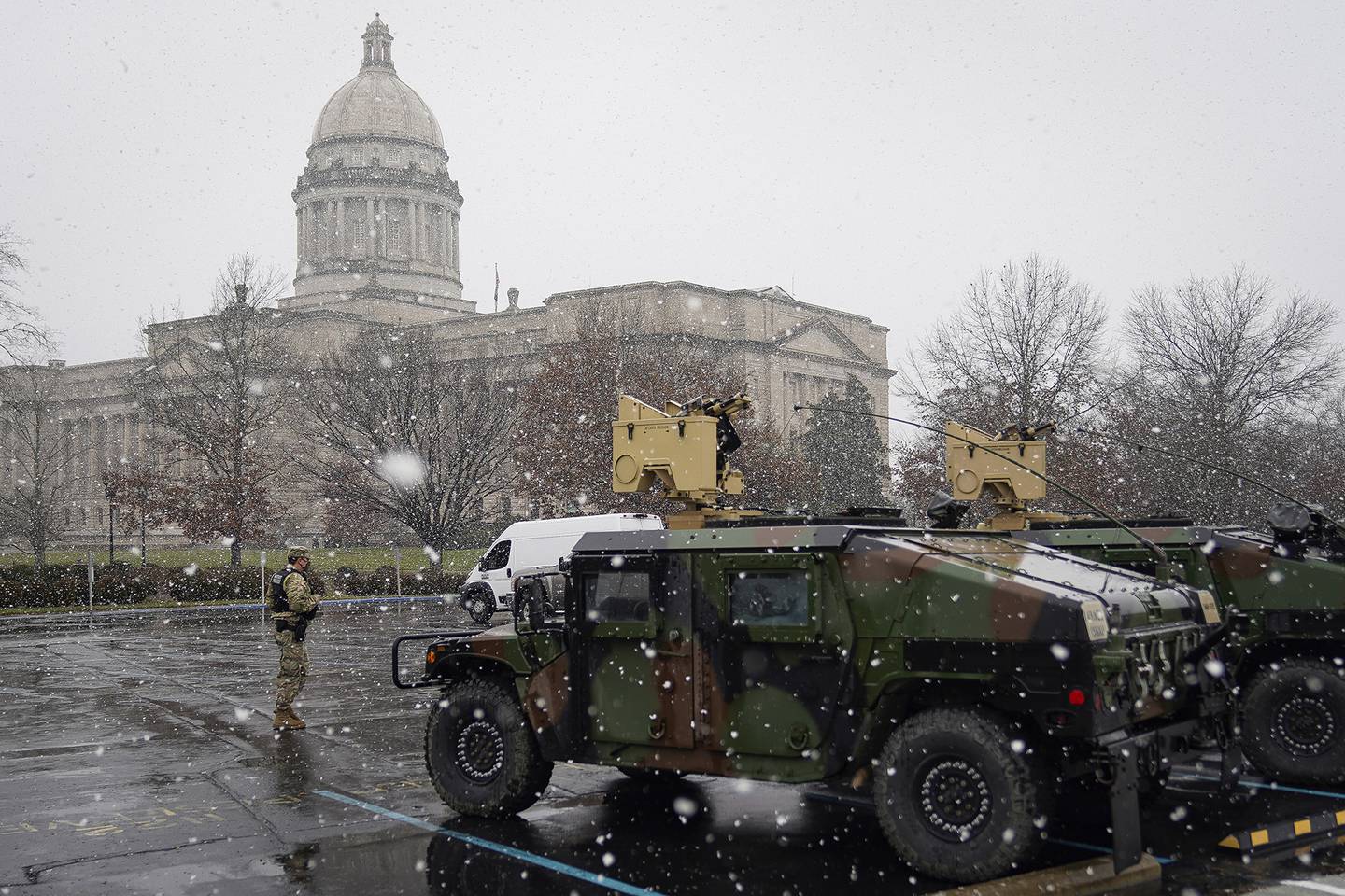A National Guard soldier stands outside the Capitol building in Frankfort, Ky., Sunday, Jan. 17, 2021.