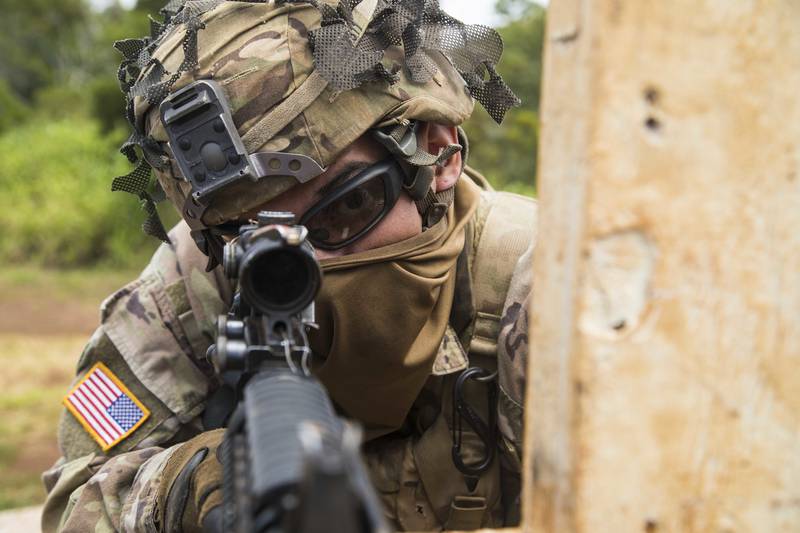 A soldier scans his lane during a rifle qualification range May 1, 2020 at Schofield Barracks, Hawaii.