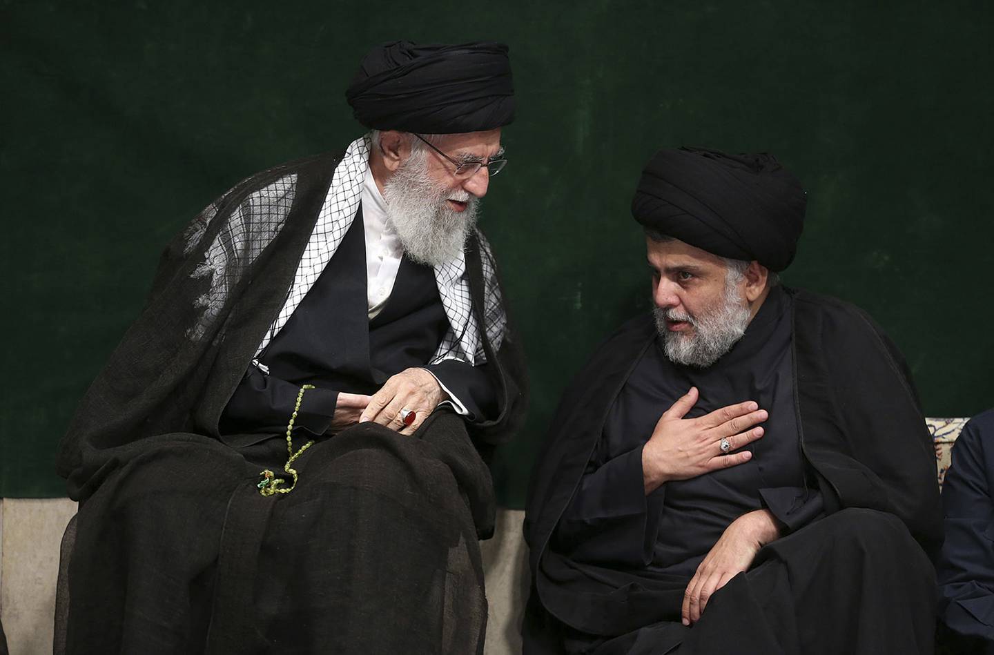 Supreme Leader Ayatollah Ali Khamenei, left, greets Iraqi Shiite cleric Muqtada al-Sadr
