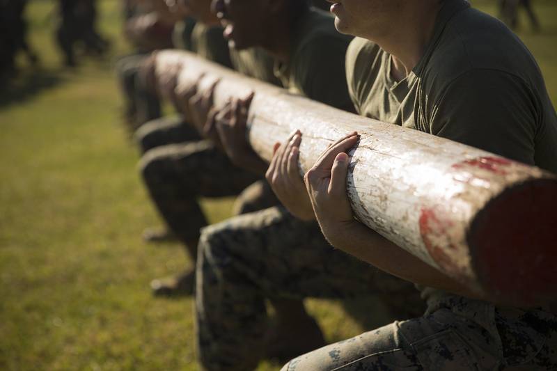 U.S. Marines with the Logistics Combat Element (LCE), Marine Rotational Force – Darwin (MRF-D), conduct log lunges during a field meet at Robertson Barracks, Darwin, Australia, July 22, 2019.