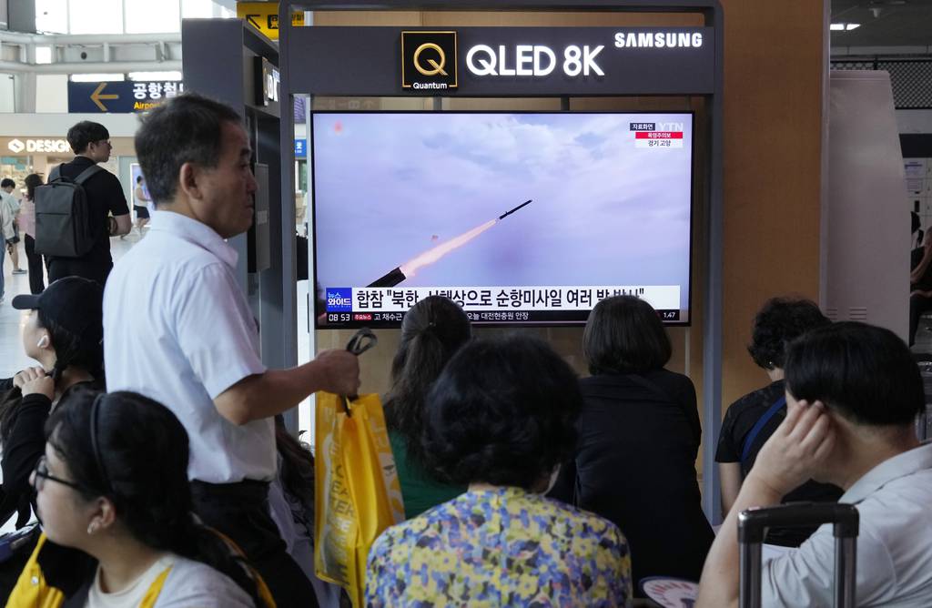 A TV screen shows a file image of North Korea's missile launch during a news program at the Seoul Railway Station in Seoul, South Korea, Saturday, July 22, 2023.