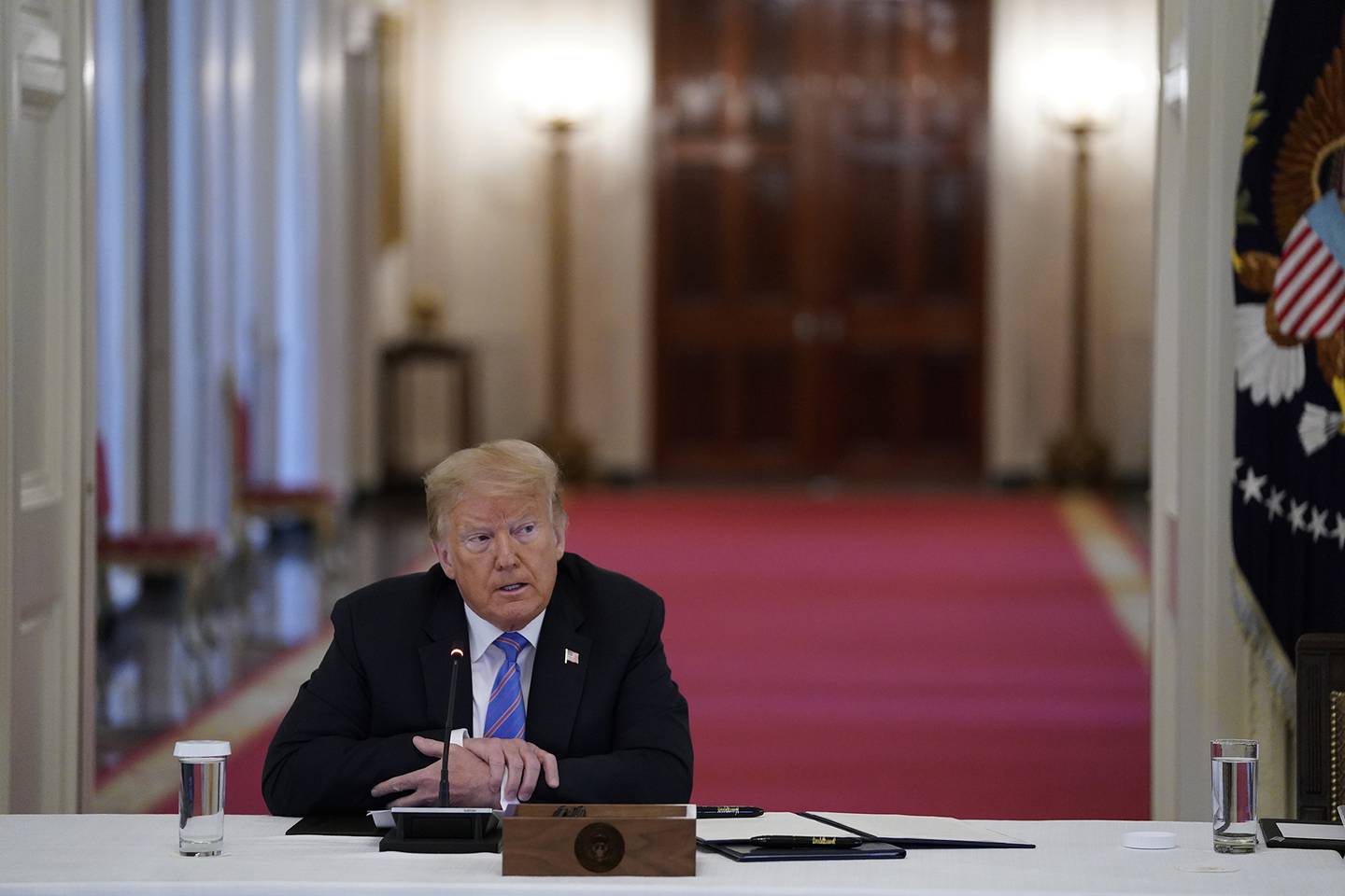 President Donald Trump listens during a meeting with the American Workforce Policy Advisory Board in the East Room of the White House on June 26, 2020, in Washington.