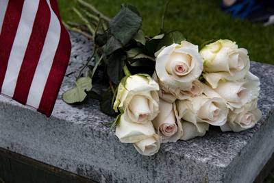 Flowers lay on a bench during a funeral for U.S. Navy Seaman Apprentice Hubert P. Hall at the National Memorial Cemetery of the Pacific, Honolulu, March 17, 2020.