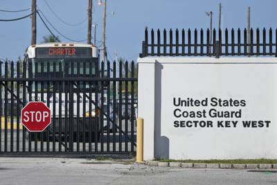 Buses carrying Cuban migrants leave from U.S. Coast Guard Sector Key West, Thursday, Jan. 5, 2023, in Key West, Fla.