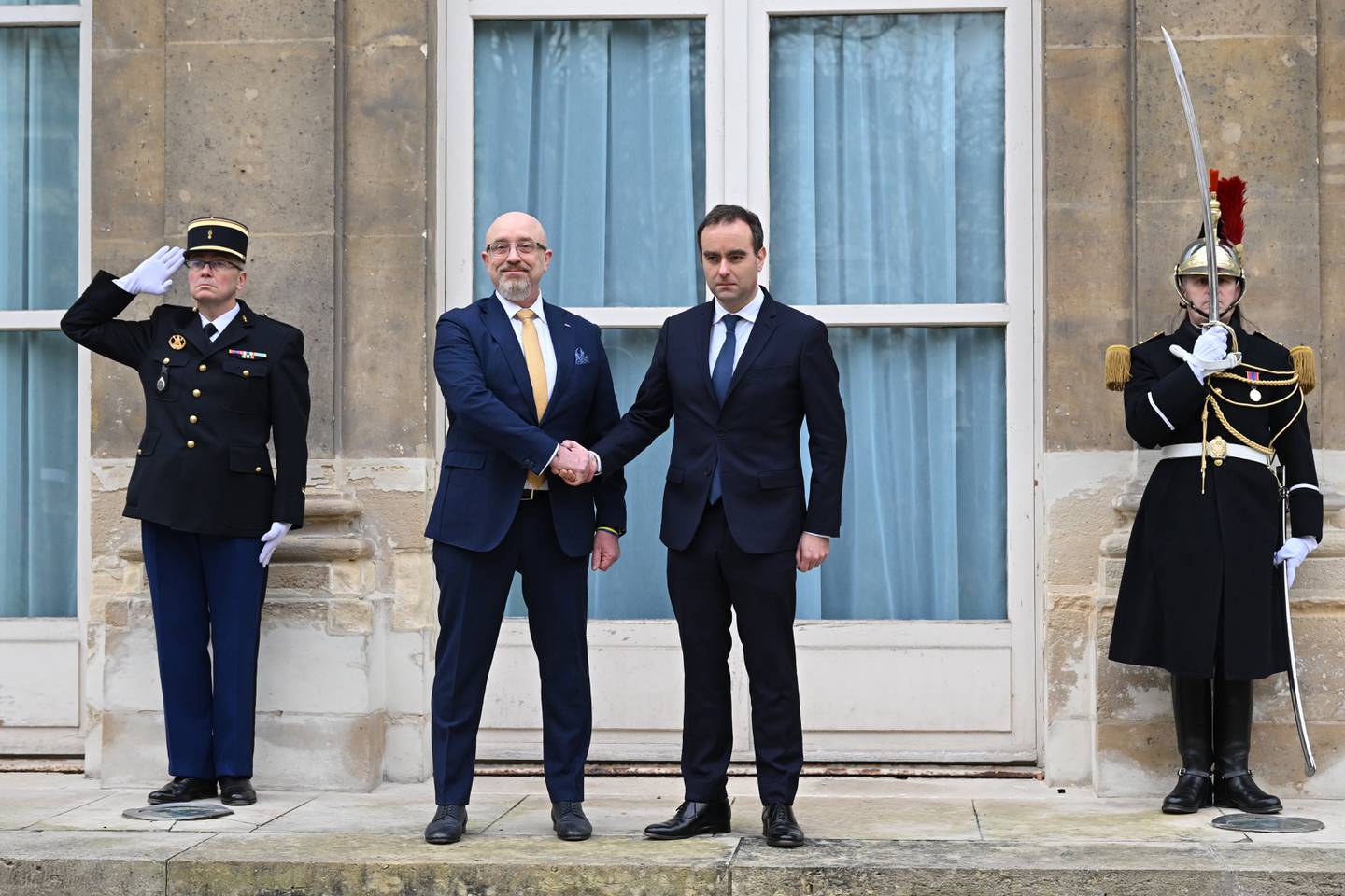 French Defense Minister Sebastien Lecornu, center right, and Ukrainian Minister of Defense Oleksii Reznikov pose during Reznikov's official visit at the French Defense Ministry, in Paris Tuesday, Jan. 31, 2023.