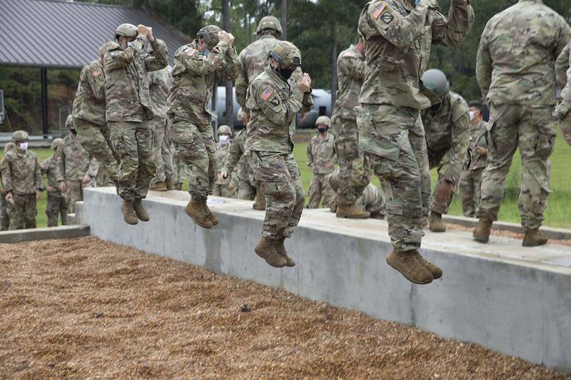 A group of U.S. Army paratroopers conducts a Parachute Landing Fall at the Warrior Training Center, Fort Benning, Ga., Aug. 24, 2020.