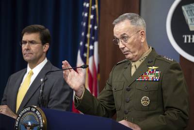 Joint Chiefs Chairman Gen. Joseph Dunford with Secretary of Defense Mark Esper speaks to reporters during a briefing at the Pentagon, Wednesday, Aug. 28, 2019.