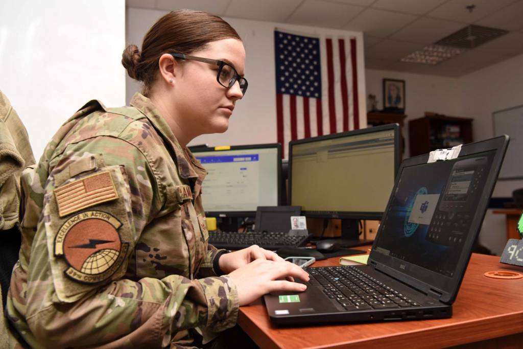 U.S. Air Force Senior Airman Kaitlyn Schramek, 39th Communications Squadron voice systems technician, troubleshoots a voice communicator app, May 5, 2020, at Incirlik Air Base, Turkey. Voice systems technicians ensure voice communications are accessible at work and from home. (Tech. Sgt. Jim Araos/Air Force)