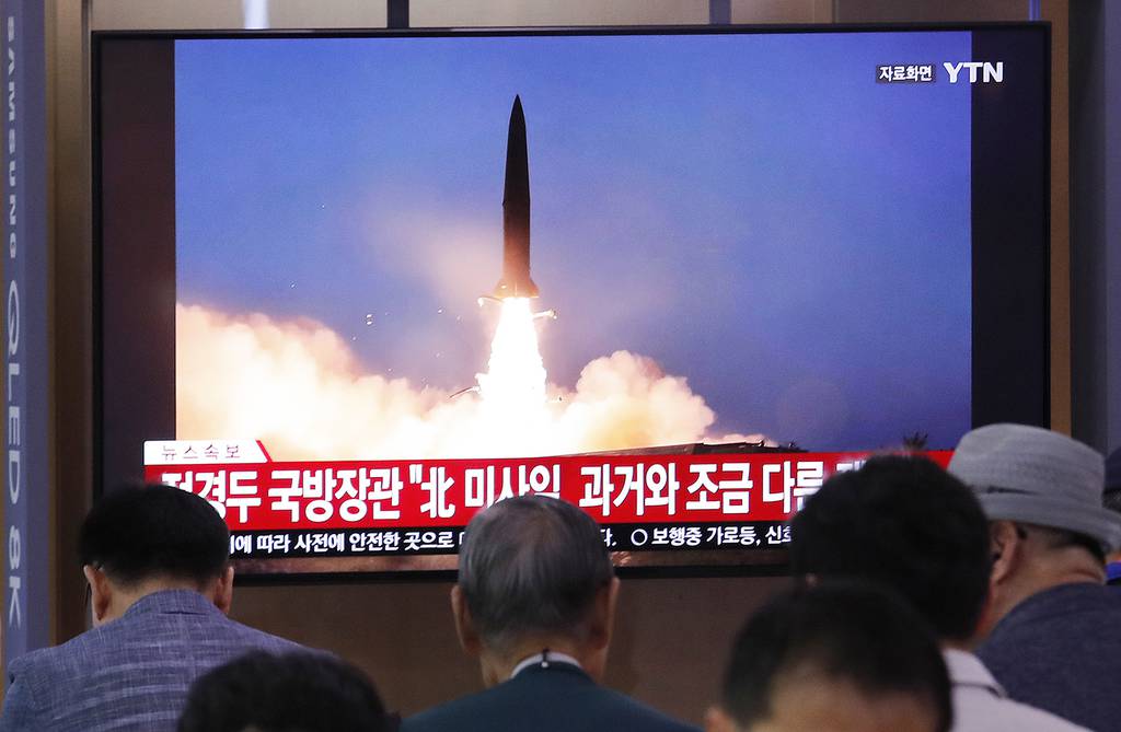 People watch a TV showing a file image of North Korea's missile launch during a news program at the Seoul Railway Station in Seoul, South Korea, Wednesday, July 31, 2019.