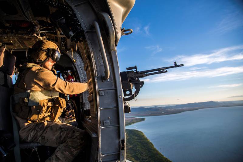 A crew chief scans the skies while on a mission to emplace U.S. and Australian special operations forces during Talisman Sabre, July 12, 2019, in Queensland, Australia.