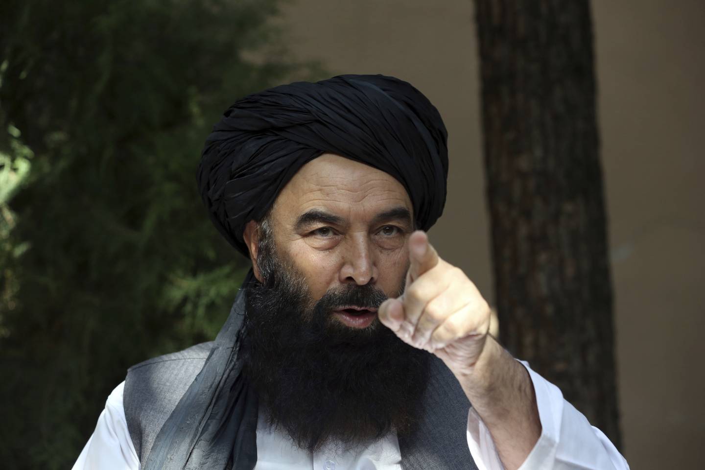 In this Thursday, Aug. 29, 2019, photo, A former Taliban military leader Syed Akbar Agha speaks during an interview with the Associated Press in Kabul, Afghanistan.