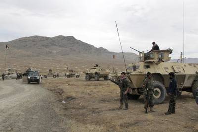 Afghan national army soldiers arrive at the site of a suicide bombing in Ghazni province west of Kabul, Afghanistan, Sunday, Nov. 29, 2020.
