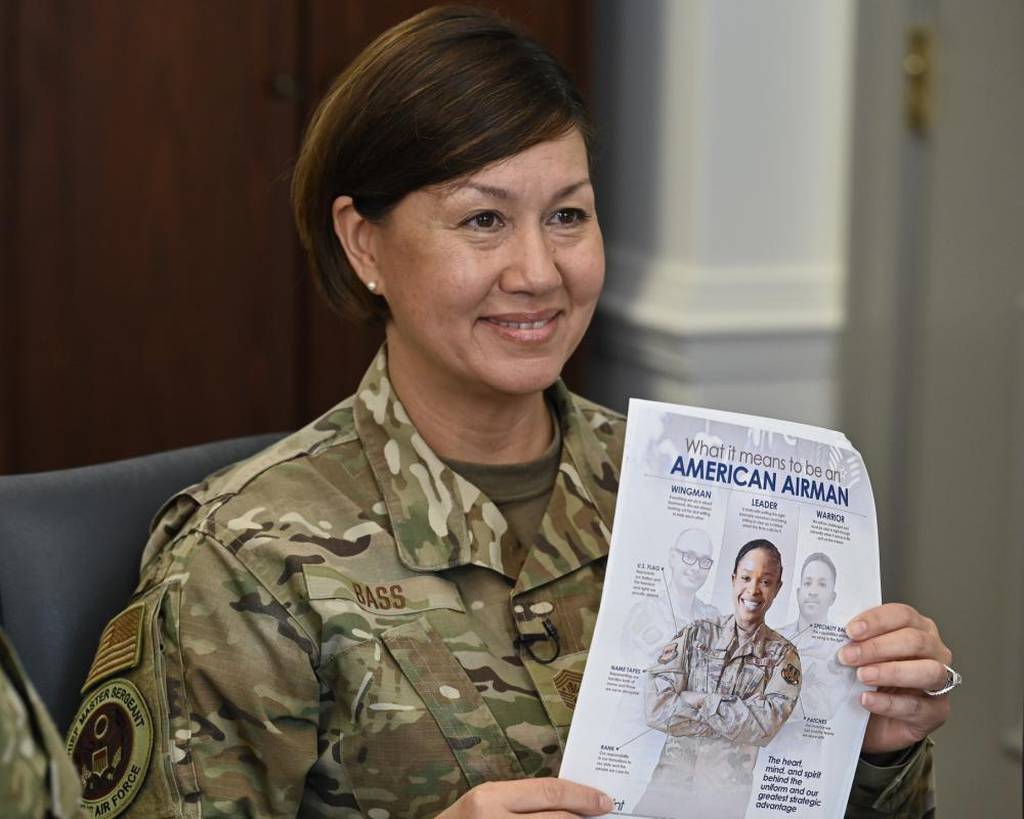 Chief Master Sergeant of the Air Force JoAnne S. Bass holds up a document during her live-streamed show, “Coffee Talk,” at the Pentagon, Arlington, Va., April 22, 2022. Bass, Chief Master Sgt. Stefan Blazier and Chief Master Sgt. Keith Castille answered viewer questions and discussed issues affecting the Air Force enlisted and total forces. (Eric Dietrich/Air Force)