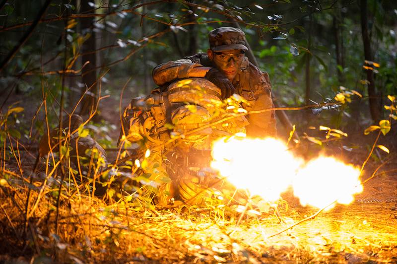 Staff Sgts. Jose Obregon and Joseph Pace, Ranger Assessment Course students, fire on opposing forces during a simulated react to contact near Schofield Barracks, Oahu, Hawaii, May 23, 2019.