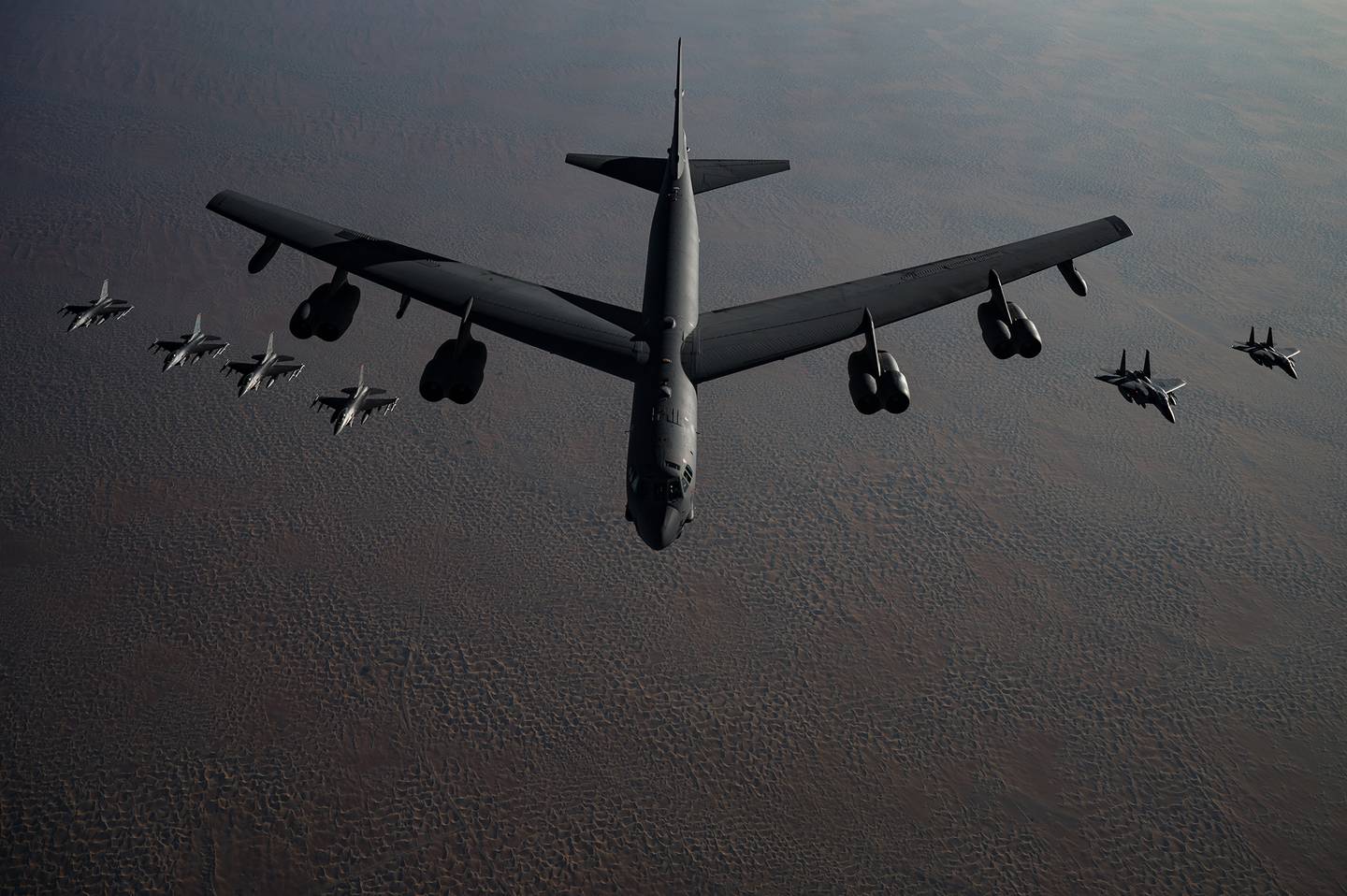 A B-52 Stratofortress flies in formation with F-16 Fighting Falcons and F-15E Strike Eagles during a Bomber Task Force mission over the U.S. Central Command area of responsibility, Nov. 21, 2020.