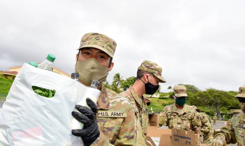 Members of the Hawaii National Guard team with Maui county officials and volunteers to distribute groceries at a community food drive in support of COVID-19 operations, Wailuku, Hawaii, April 24, 2020.