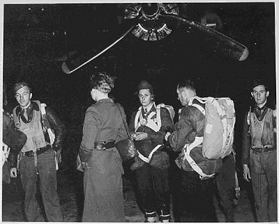 Members of the clandestine 'Jedburghs' teams in front of a B-24 just before night takeoff.