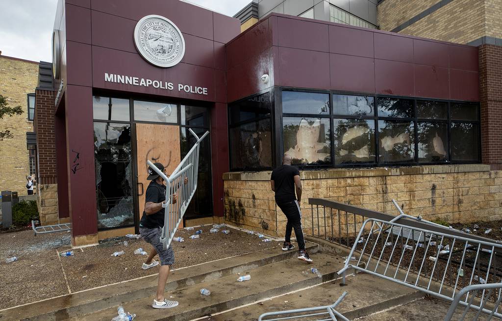 Protesters damage properties at the Minneapolis 3rd Police Precinct in Minneapolis on Wednesday, May 27, 2020.