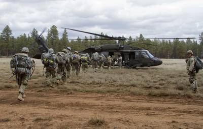 Soldiers board a UH-60 Black Hawk helicopter during an air assault exercise on the first lane of the Arizona National Guard Best Warrior Competition 2019 at Camp Navajo in Bellemont, Ariz., on April 16, 2019.