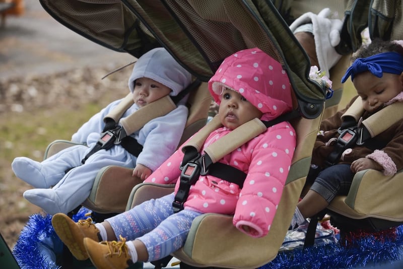 Infants sit in a stroller during Yoiko Child Development Center Month of the Military Child parade at Misawa Air Base, Japan, April 3, 2017. (Staff Sgt. Melanie Hutto/Air Force)
