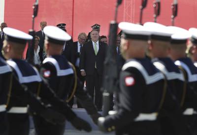 U.S. Secretary of State Mike Pompeo stands in respect for the Polish military as Poland marks the centennial of the Battle of Warsaw, a Polish military victory in 2020 that stopped the Russian Bolshevik march toward the west, in Warsaw, Poland, Saturday Aug. 15, 2020.