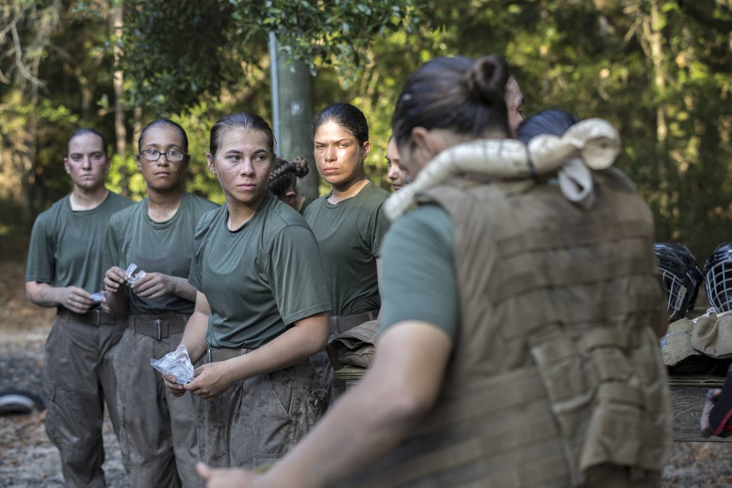 Members of a platoon of female U.S. Marine Corps recruits gear up before training in hand-to-hand combat at the Marine Corps Recruit Depot, Thursday, June 29, 2023, in Parris Island, S.C.