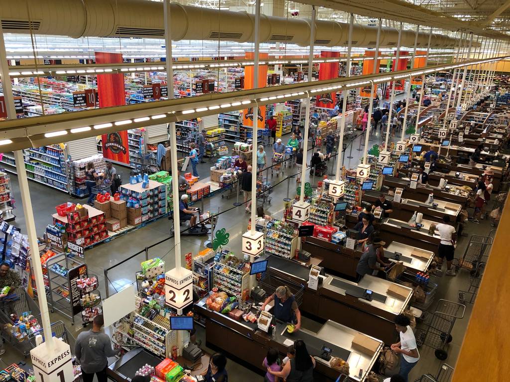 Government auditors question whether commissaries are providing the savings intended. Pictured here, customers checking out at the commissary at Naval Air Station Jacksonville, Fla. (DeCA)
