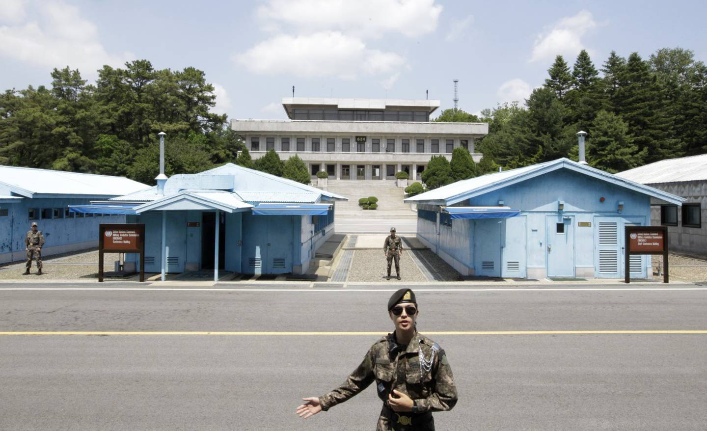 A South Korean soldier gestures during a press tour at the Panmunjom in the Demilitarized Zone, South Korea.