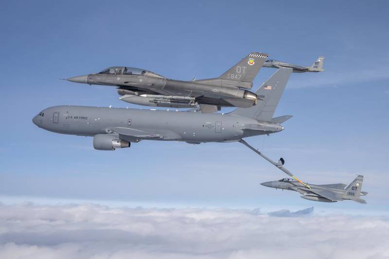 A KC-46 Pegasus assigned to the 931st Air Refueling Wing, McConnell Air Force Base, Kansas, refuels an F-15C Eagle while an F-16 Fighting Falcon and F-15C assigned to Eglin AFB, Florida, fly alongside over the Gulf of Mexico on Nov. 18, 2021. The aircraft were participating in Checkered Flag 22-1, a large-force aerial exercise held at Tyndall AFB, Florida, which fosters readiness and interoperability through the incorporation of fourth- and fifth-generation aircraft during air-to-air combat training. (Staff Sgt. Betty R. Chevalier/Air Force)