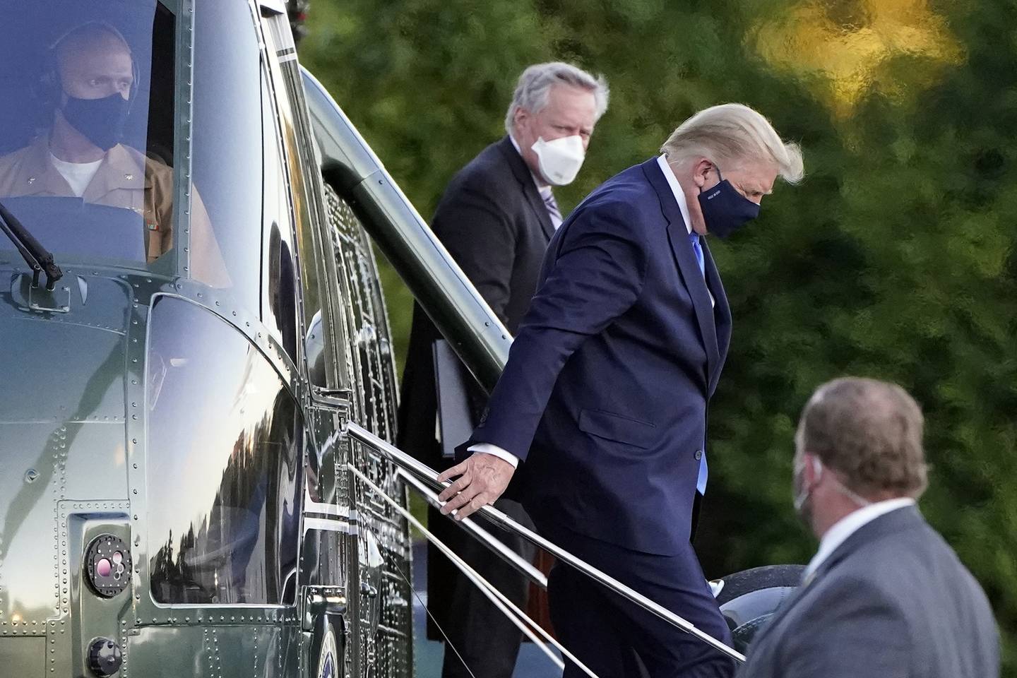 President Donald Trump arrives at Walter Reed National Military Medical Center, in Bethesda, Md., Friday, Oct. 2, 2020, on Marine One helicopter after he tested positive for COVID-19.